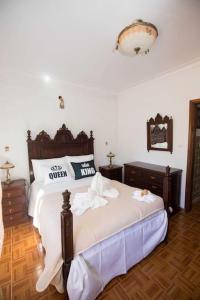 Un pat sau paturi într-o cameră la Casa 'Saudade'