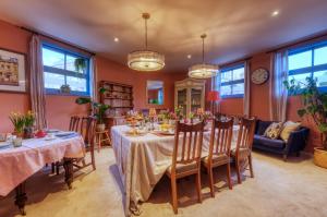 a dining room with a table and chairs at Hill House in Bath