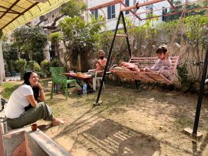 a group of people sitting in a swing at JWALA JAIPUR in Jaipur
