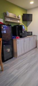 a kitchen with a counter with several appliances at Hotel Aits garni in Nordenham