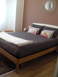 a bed in a bedroom with a blue mattress at Appartamento ARCOBALENO in Tirano