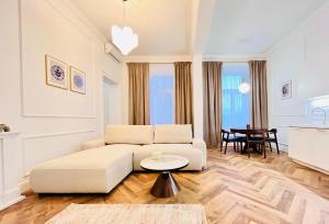 a living room with a couch and a table at Apartamenty Lubin - Noclegi Lubin in Lubin