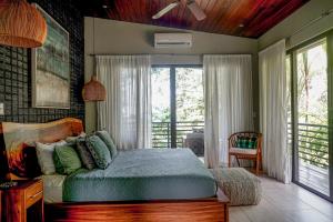 Ένα ή περισσότερα κρεβάτια σε δωμάτιο στο Casa Vista Verde +33 φωτογραφίες