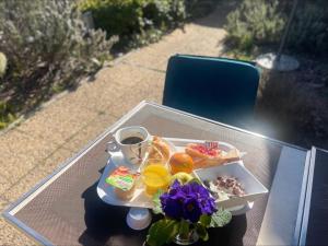 a tray of food and a drink on a table at Premiere Classe Montpellier Ouest - St Jean De Vedas in Saint-Jean-de-Védas