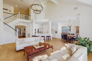 a living room with a couch and a table at The Woodlands Retreat in The Woodlands