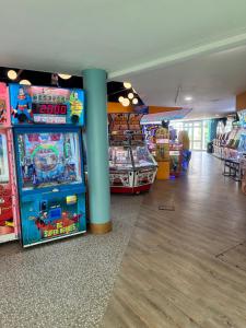 a room with several arcade games in a store at Serenity Coast in Wyke Regis