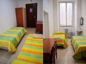 Postel nebo postele na pokoji v ubytování Ostello Marello + 4 fotografie
