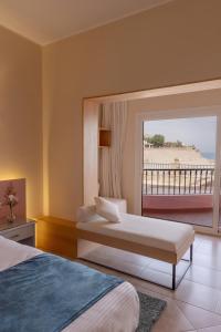 a bedroom with two beds and a view of a beach at La Siesta Hotel Al Sokhna in Ain Sokhna