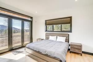 A bed or beds in a room at Custom Windham Mtn Villa with Pool, Theater and Views!
