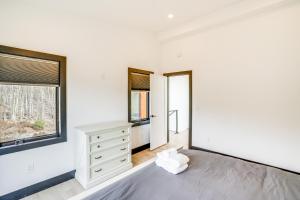 A bed or beds in a room at Custom Windham Mtn Villa with Pool, Theater and Views!