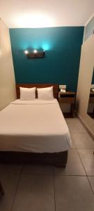 Cama ou camas em um quarto em Hotel Residencial Alfa