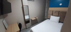 Cama ou camas em um quarto em Hotel Residencial Alfa