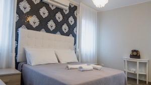 Katil atau katil-katil dalam bilik di Ca Ballarin B&B