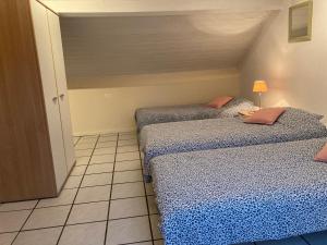 Postel nebo postele na pokoji v ubytování B&B Haus Jola