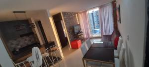 Posezení v ubytování Espectacular apartamento de 3 habitaciones con piscina y parqueadero privado Excelente Relacion Precio Calidad Puntaje