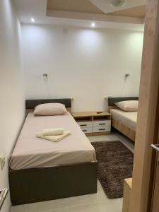a bedroom with two beds in a room at Eliksir in Gornja Trepča