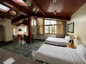 Cama ou camas em um quarto em Hotel Residencial Alfa