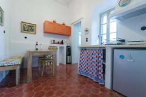 a kitchen with a table and a counter top at Livin Hydra Private Collection Suite 1 in Hydra