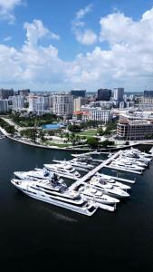 a group of boats docked in the water in a harbor at The Lofts on Clematis 404 Downtown West Palm Beach in West Palm Beach