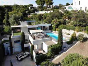 an aerial view of a house with a swimming pool at Villa JFK in Marseille