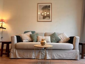 a living room with a couch and a table at Le Margériaz 32m Balcon vue in Aillon-le-Jeune