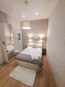 Una cama o camas en una habitación de Cosy apartamento en La Latina