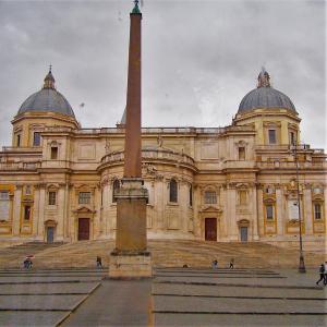 a large building with a obelisk in front of it at AltaDomus Roma in Rome