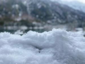 a pile of snow with a mountain in the background at Al Colle in Ateleta +4 photos