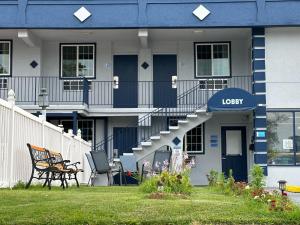 a blue and white building with a spiral staircase at Rodeway inn St Joseph in Saint Joseph