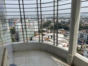 vistas desde la parte superior de un edificio con ventanas en Nice Luxury Suites, en Rājshāhi