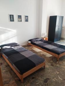 Un pat sau paturi într-o cameră la Casa Tancredi, Torino Lingotto