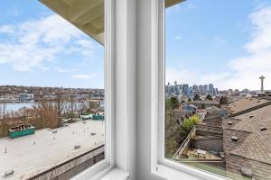 a window with a view of a city skyline at Back to The Future Sweet Suites in Seattle