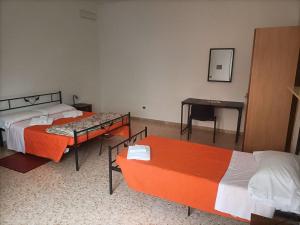 Letto o letti in una camera di CASA D'ALUNZIO - CASE PER FERIE IN OSPITALITA' DIFFUSA