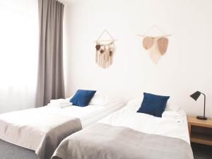 Łóżko lub łóżka w pokoju w obiekcie Hotel Beskidian