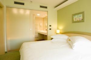 Кровать или кровати в номере Hotel Kimen