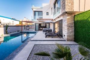 an image of a house with a swimming pool at Royal Villas in Kyrenia