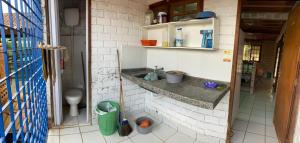 a bathroom with a sink and a toilet at Casa Aconchegante 1 in Chã Grande