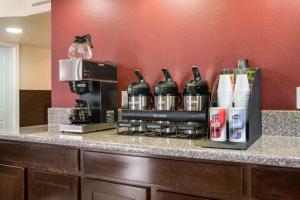 a counter with a coffee maker and a coffeemaker at Red Roof Inn Dallas - Richardson in Dallas