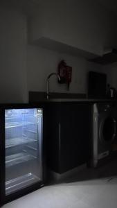 a kitchen with a sink and a microwave at Al jada / Reef 4 in Sharjah