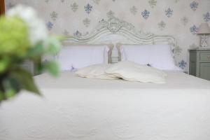 Postel nebo postele na pokoji v ubytování SALGE b&b RESIDENZA DI CHARME