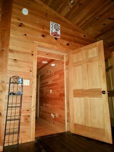 a room with a wooden door in a cabin at Perfectly Imperfect Cabin in Turtletown