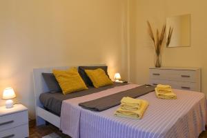 Ένα ή περισσότερα κρεβάτια σε δωμάτιο στο Appartamento Ginestra