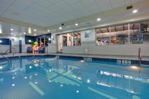 a large swimming pool in a hotel room at Holiday Inn Calgary Airport, an IHG Hotel in Calgary