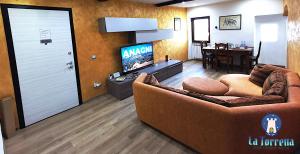 TV a/nebo společenská místnost v ubytování LA TORRETTA apartment suite