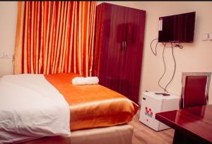 Postel nebo postele na pokoji v ubytování HOTEL D RITZ