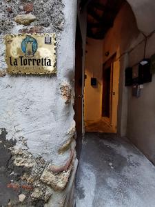 a sign on the side of a building at LA TORRETTA apartment suite in Anagni