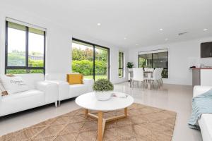 a white living room with a white couch and a table at Entire home in Mount Barker in Mount Barker