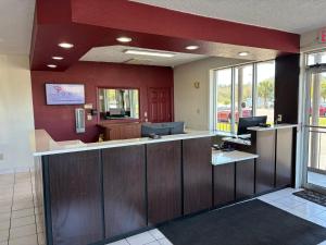 a lobby of a hospital with a reception counter at Red Roof Inn Wildwood, FL - The Villages in Wildwood