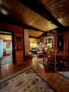 a living room with a table and a couch at Sälen, Tandådalen in Sälen