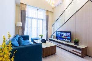 TV o dispositivi per l'intrattenimento presso Serveyou International Apartment - Free Airport Pickup & Free Canton Fair Shuttle Bus